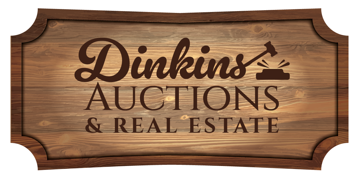 A wooden sign that says dinkins auctions and real estate.